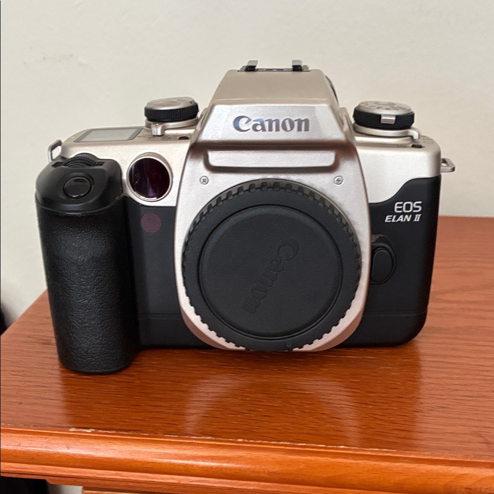 Canon EOS Elan ll 35 mm SLR autofocus camera body with silver top plate
